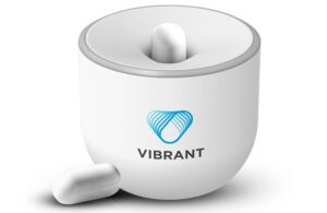 Vibrant Gastro's white, pill-sized capsules and a device for activating them